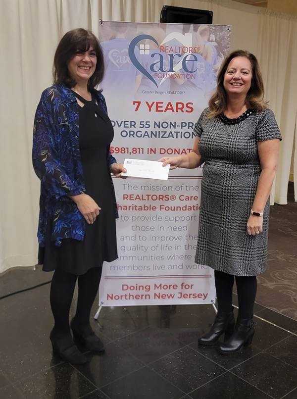 Pictured: Karen DeMarco, President of The Food Brigade; Maureen Mamunes, President of the Realtors® Care Foundation.