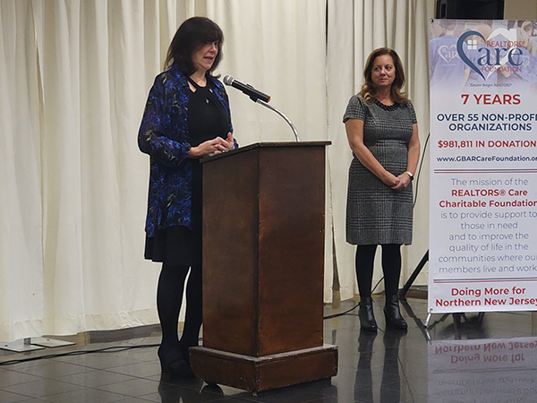 Food Brigade President Karen DeMarco addresses audience at the Realtors Care Foundation's annual grant awards ceremony on the state of food insecurity in Bergen County and northern New Jersey