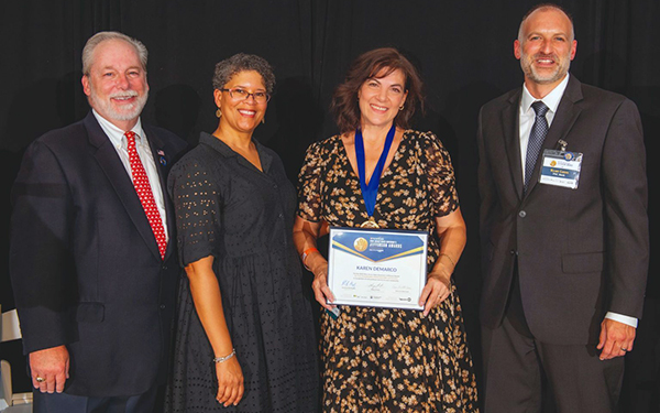 Food Brigade President Karen DeMarco being awarded the NJ Governor's Jefferson Award