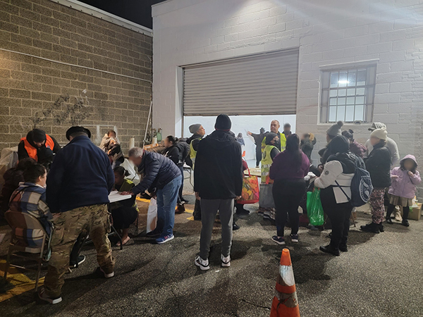 newly registered clients receiving free restaurant-prepared packaged meals at The Food Brigade's new Hudson County food pantry in Union City