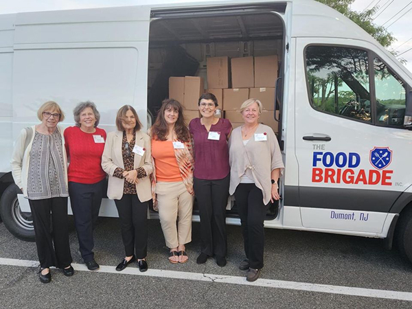 Women's Foundation of New Jersey members with Food Brigade President Karen DeMarco in front of the 