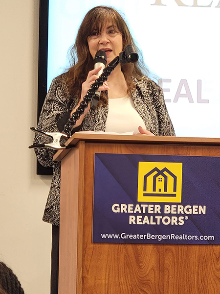 Food Brigade President Karen DeMarco speaking before the Greater Bergen Realtors Care Foundation